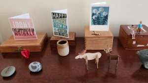 Picture of surface with knick-knacks and cards.